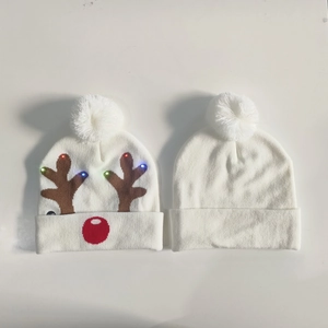 White knitted Christmas hat with reindeer pattern and built-in LED glowing lights