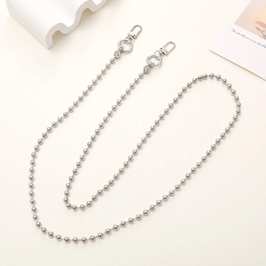 Detailed view of a silver metal ball chain strap with lobster clasps on a clean background