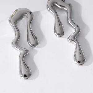 Minimalist liquid metal geometric earrings with silver mirror finish on a white stand