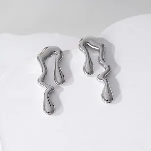 Minimalist liquid metal geometric earrings with silver mirror finish on a white stand