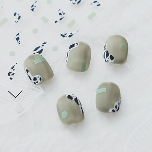 Matte sage green nail stickers featuring cow print and geometric patterns in ins style
