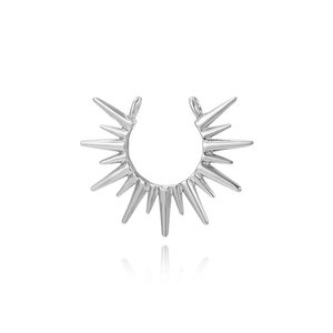 Macro shot of silver sunburst semi-circle necklace connector with radiating spikes