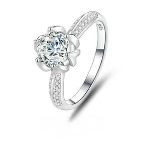 Macro shot of S925 sterling silver stamp and six-prong crown setting with brilliant moissanite