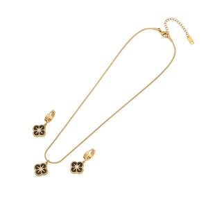 Gold stainless steel jewelry set with black clover pendants and star details