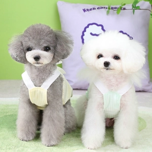 Close-up of cute ribbed knit pet tank tops on two small dogs in soft pastel colors