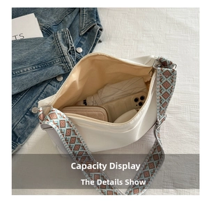 Interior view of white nylon shoulder bag showing spacious capacity for daily essentials