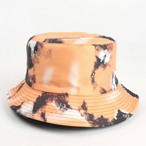 Detailed view of the multi-colored tie-dye stitching on a reversible sun bucket hat
