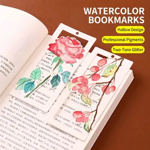 Artistic watercolor hollowed-out bookmarks featuring red floral designs on book pages