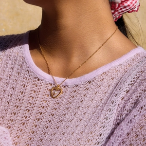 Classic 18K gold plated heart necklace with Czech diamond worn by a fashion model