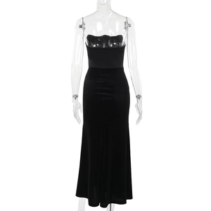 Detail of elegant black velvet patchwork sleeveless dress with cinched waist design