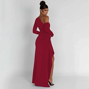 Detail of red one-shoulder evening dress featuring a high slit and backless sexy cut