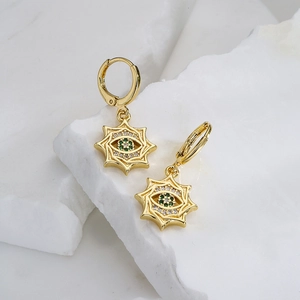18K gold-plated evil eye hoop earrings with green zircon star charms on marble