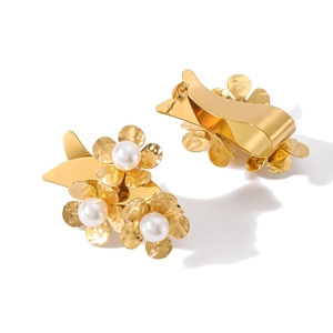 Chic gold flower earrings with pearls and metal petals on a clean white background