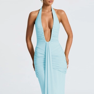 Detail of the elegant light blue halter dress featuring a deep V-neck and pleated waistline
