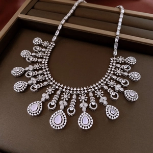 Detailed macro view of French style pink zircon water drop pendant necklace in a gift box