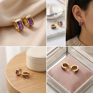 Detail view of gold stainless steel hoop earrings with faceted rectangular purple gems