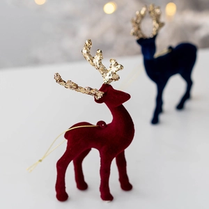 Glittering flocked Christmas reindeer ornaments in red and blue with gold sequins