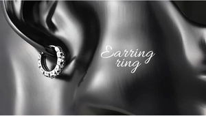 Close-up of vintage silver skull earring showing punk style relief pattern and detail