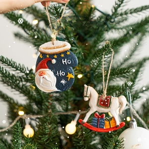 Christmas tree ornaments featuring Santa gloves and rocking horse on festive background