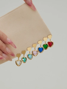 Detailed showcase of heart-shaped crystal earrings in various colors with gold plating