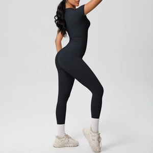 Close-up detail of high-elastic black yoga set with short sleeve top and high waist leggings