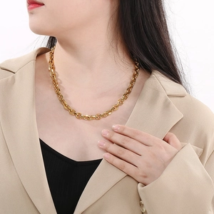 Minimalist gold stainless steel O-chain necklace with OT buckle shown on model