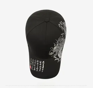 Detail of silver dragon embroidery and Chinese calligraphy on a black baseball cap