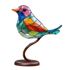 Artistic colorful mosaic bird ornament with a bronze curved stand on a white background