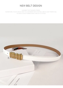 Detail of white lychee leather belt featuring vintage gold multi-column metal buckle