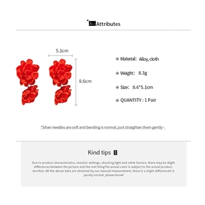 Detailed view of red fabric flower earrings with alloy studs and size specifications