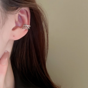 Detail of silver layered zircon ear cuff on model, no piercing minimalist jewelry design