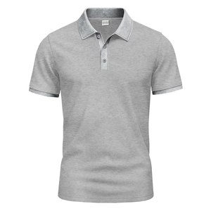 Close-up of the grey short-sleeve polo shirt showing the size M wash label and fabric texture