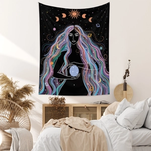 Detailed bohemian tapestry showing a goddess and sun moon phases in a cozy bedroom setting