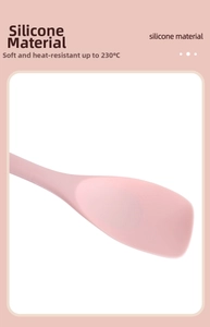 Close-up of pink silicone spatula head showing flexible heat resistance up to 230°C