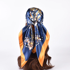Floral satin square silk scarf in navy blue with golden orange border details