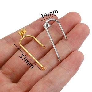 U-shaped stainless steel earrings in gold and silver finish measuring 14mm by 37mm