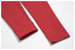Close-up of bright red yoga bodysuit leg cuffs with seamless stitching and elastic fabric