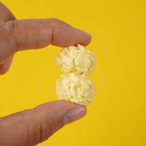 Close-up of realistic PVC spherical popcorn models with detailed irregular texture