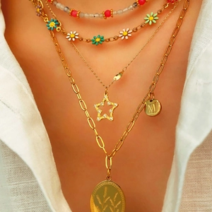 Layered gold necklace set with colorful beads, floral charms, and an initial M pendant