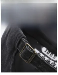 Detail of adjustable metal buckle and corduroy fabric on a retro baseball cap