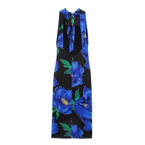 Halter neck backless maxi dress in black with vibrant blue floral patterns for beach vacation