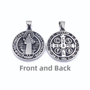 Macro detail of St. Benedict medal showing both front and back relief engravings