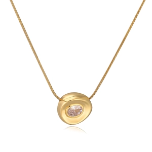 Detail shot of a gold-plated irregular geometric pendant necklace with a clear zircon stone