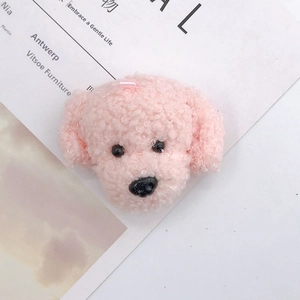 Cute pink plush teddy dog charm accessory with curly faux fur texture on white card