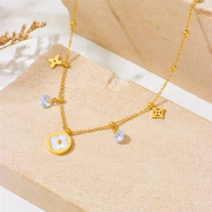 Gold titanium flower necklace with white shell clover charms and sparkling crystals