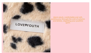 Macro detail of plush leopard print fabric with white LOVE YOUTH leather tag on cosmetic bag