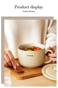Detail of cream ceramic noodle bowl with Twinkle lettering and vertical ribbed texture