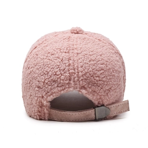 Soft pink faux shearling baseball cap with an adjustable back strap for winter warmth