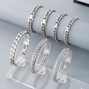 Polished stainless steel Cuban link bracelets in various widths for a minimalist style
