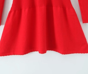 Detailed view of the wavy knit hem on this stylish red slim fit knitted dress for women